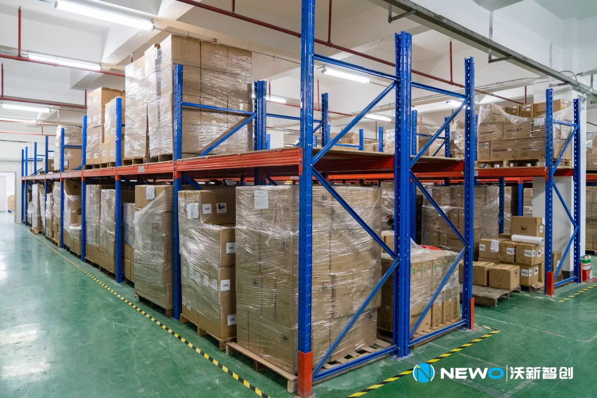 Finished goods stored on racks at the NEWO factory