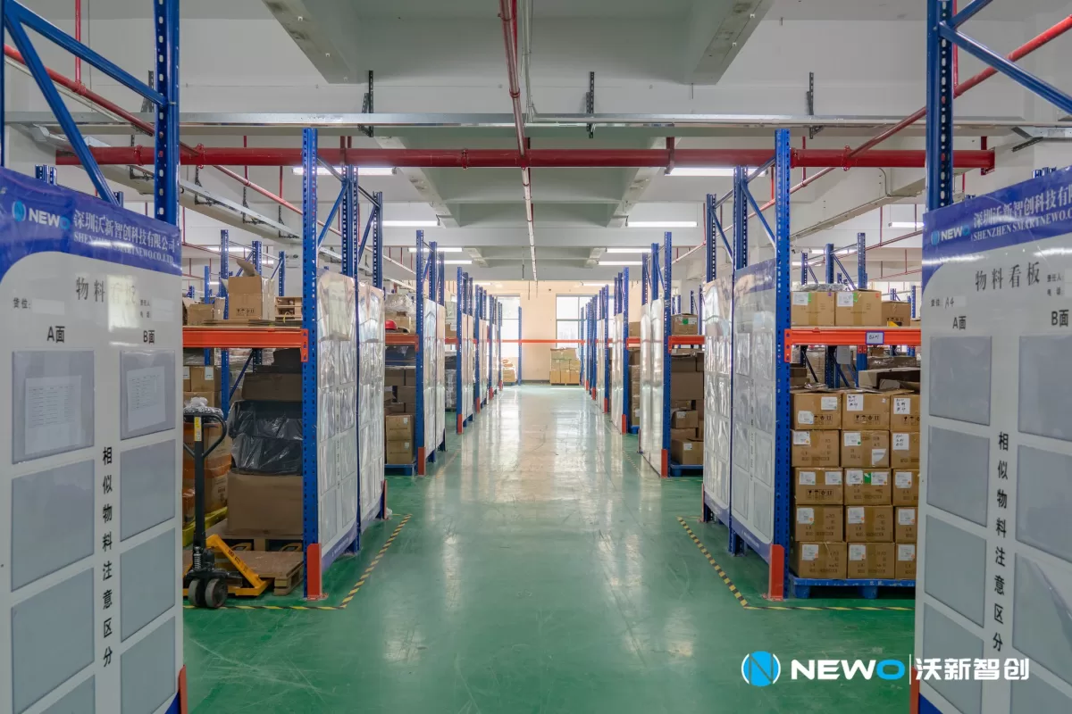 Organized material storage area inside the NEWO factory