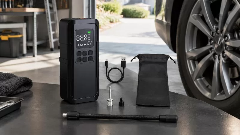 Portable tire inflator in roadside automotive use Usage view of the LP6 portable tire inflator held beside an alloy car wheel and treaded tire