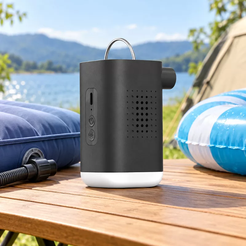 Compact Cylindrical High-Pressure Electric Air Pump Front three-quarter product view of a compact dark gray cylindrical electric air pump with an orange top panel and front display